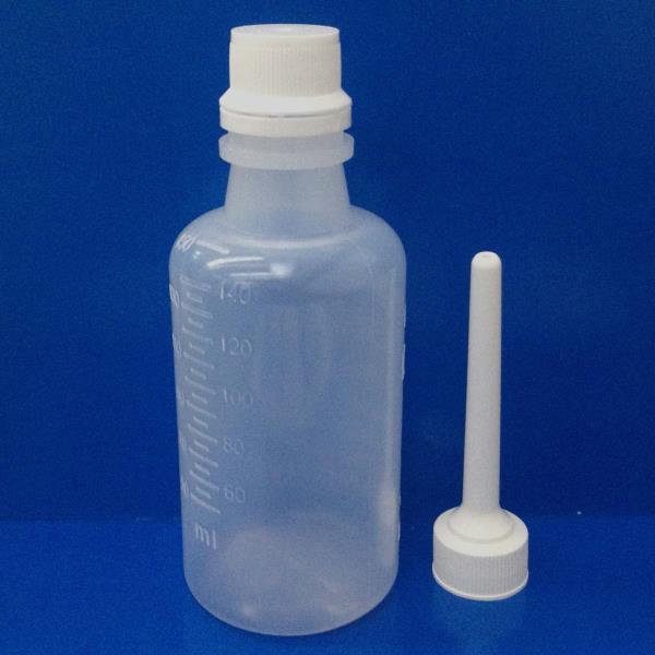 Enema bottle with TE closure and applicator